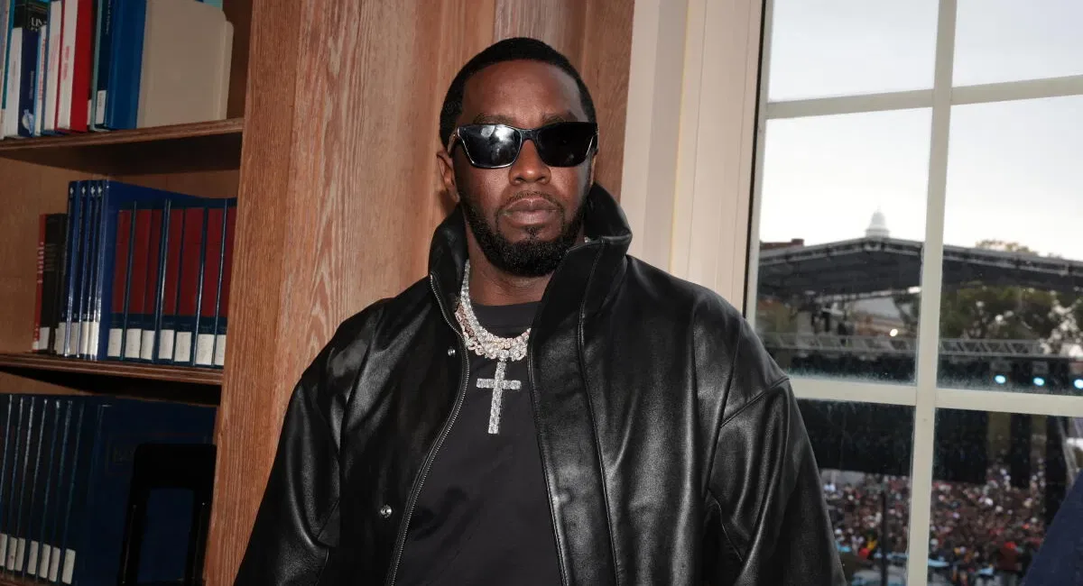 Diddy Is Taken From Fort Dix Prison for Treatment of a Head Injury Sean "Diddy" Combs in a black leather jacket, dark sunglasses and a cross chain, next to a wooden bookcase